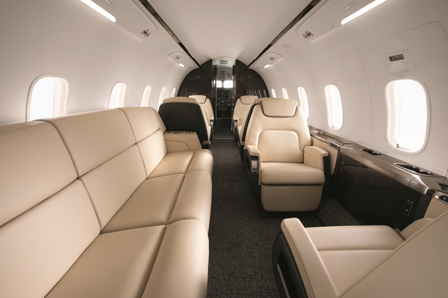 A couch inside the Challenger 350 business jet